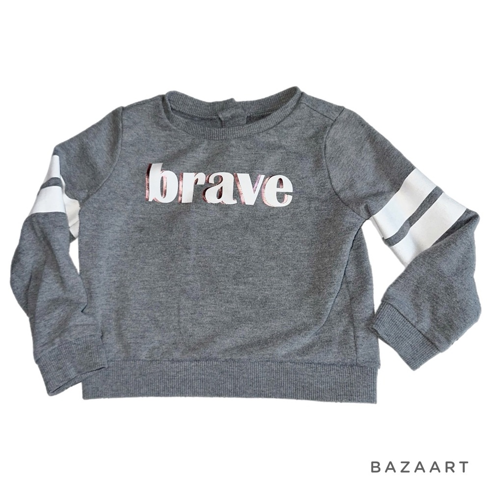 Toddler “Brave” sweatshirt with one snap button on back of neckline.